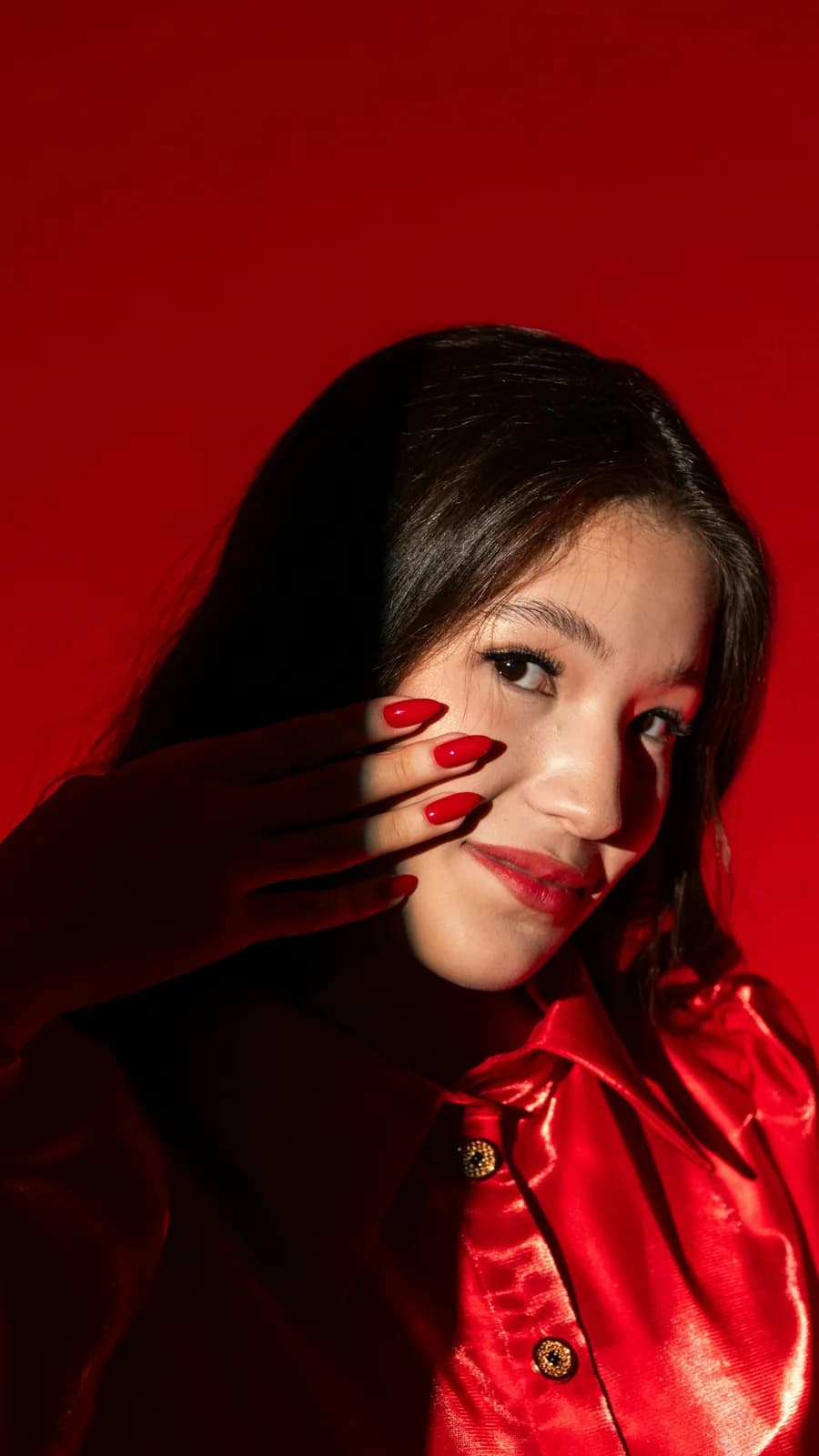 Model in red with red nails